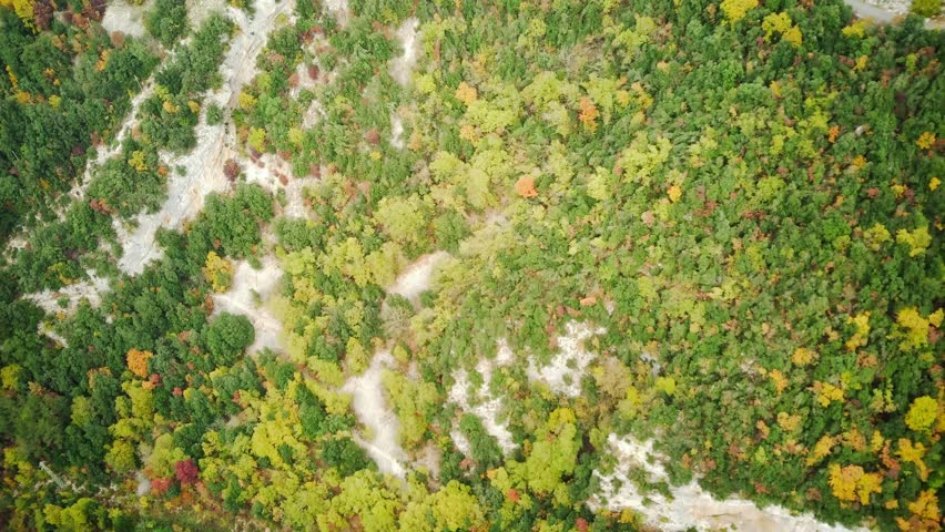 Autumn view of the mountains of Italy. Beautiful autumn landscape with colorful trees. Aerial drone shot.