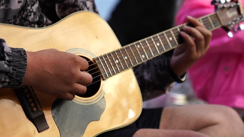 Close up man's hand playing the guitar Royalty-Free Stock Footage #1100103365