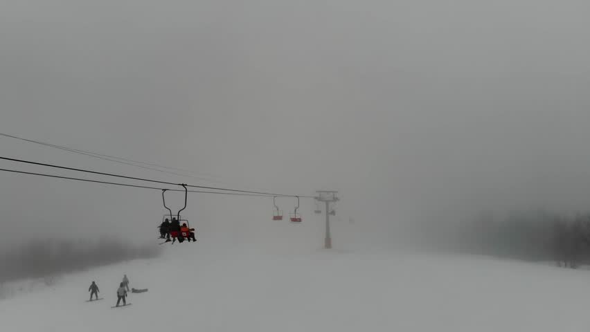 Shot from the drone of the funicular to the Himba mountain. Ski resort Pylypets in the Carpathians of Ukraine. Prepared tracks for skiers and snowboarders. The longest ski run in Ukraine. Cableway