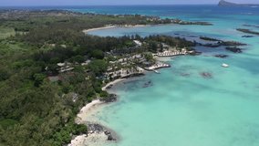 Aerial panning left from Anse La Raie Beach via St Francois Public Beach to Calodyne - aerial video view of Mauritius north coast with amazing landscape and turquoise sea - video footage