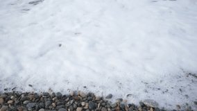 Sea waves and beach pebbles, slow motion close-up footage. Nature scene. - Powered by Shutterstock - Get 15% off with code: PIKWIZARD15