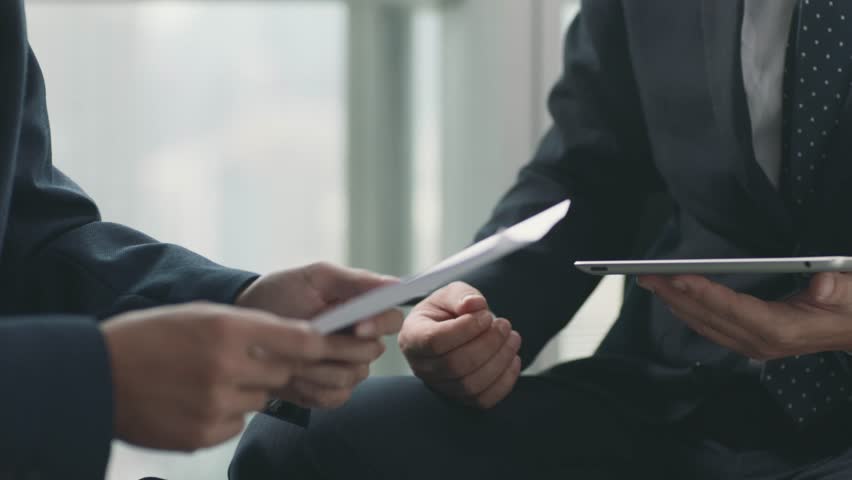 close-up shot of two business men shaking hands after discussion in office Royalty-Free Stock Footage #1100109697