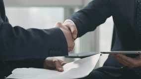 close-up shot of two business men shaking hands after discussion in office - Powered by Shutterstock - Get 15% off with code: PIKWIZARD15