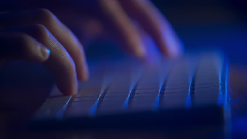 Hands typing on keyboard. Blue light. Man working on computer in a dark. Close up fingers typing on computer. Working night. Work force. Late night working. Shallow depth of field. Cinematic DOF. | Shutterstock HD Video #1100110249