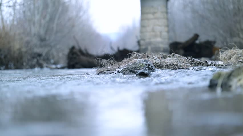 Water flowing in a river. A fast flowing stream