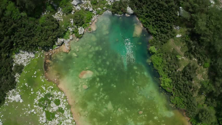 Blue Lake, located in the heart of Montenegro, Durmitor, is a serene and tranquil body of water surrounded by rolling hills and lush greenery. 