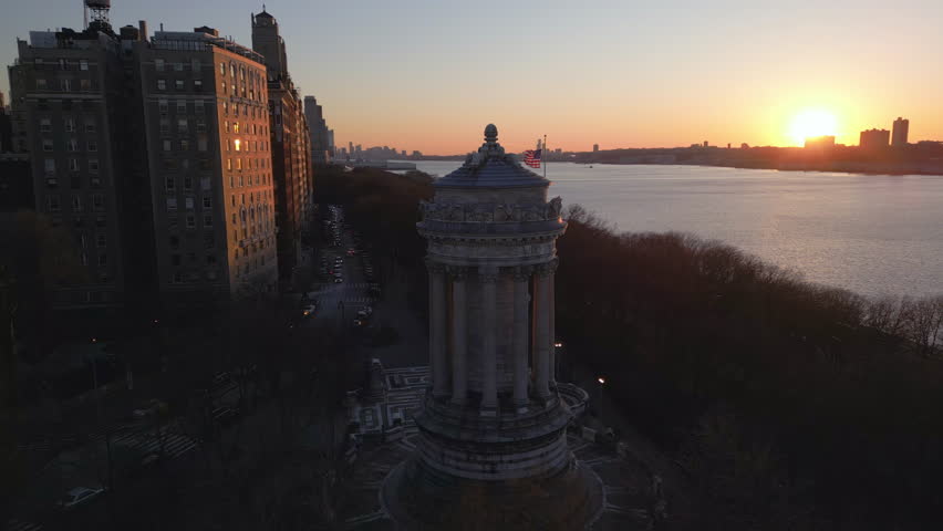 sunset flying counter clockwise around Soldiers and Sailors Monument in Riverside Park NYC