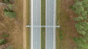 Speed monitoring equipment over highway road, aerial top down view