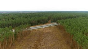 A6 highway road in woodland area with speed monitoring device, aerial drone view