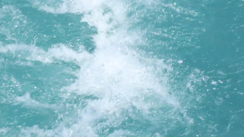 Rolling waves in the ocean. blue water background with white foam.  | Shutterstock HD Video #1100125613
