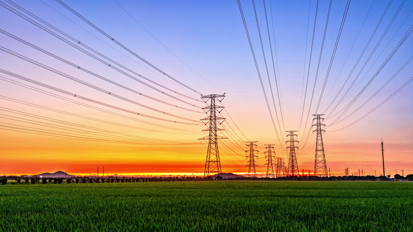 High voltage electric towers at sunrise. Transmission power line. Electricity pylons and sky clouds background. | Shutterstock HD Video #1100126711