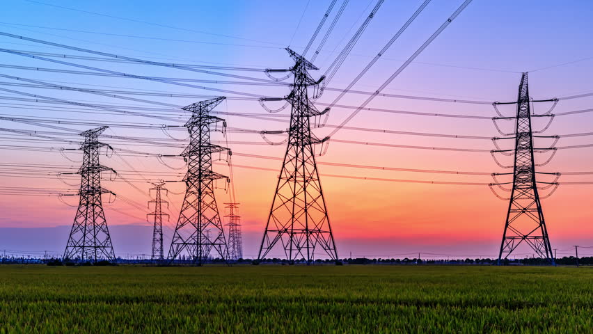 High voltage electric towers at sunset. Transmission power line. Electricity pylons and sky clouds background. | Shutterstock HD Video #1100126751