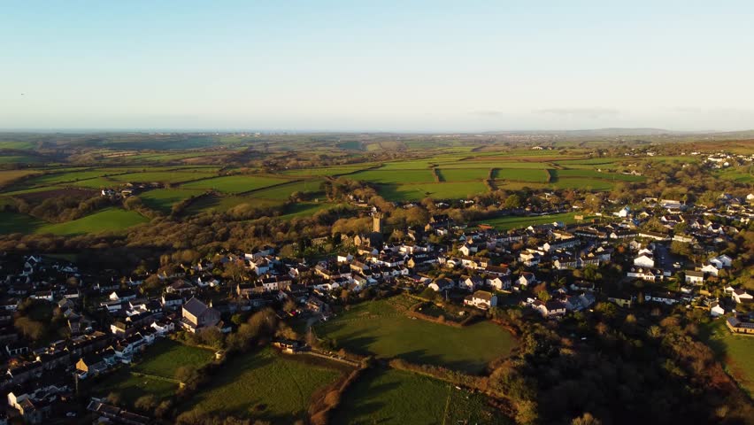 Aerial overview of Constantine village in Cornwall, UK with farms and farmland surrounding