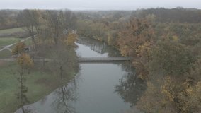Bridge over a river flowing through the woods - Drone video - DJI D-Cinelike color profile