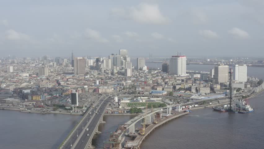 Drone shot orbits around island Lagos, Nigeria. Royalty-Free Stock Footage #1100135207