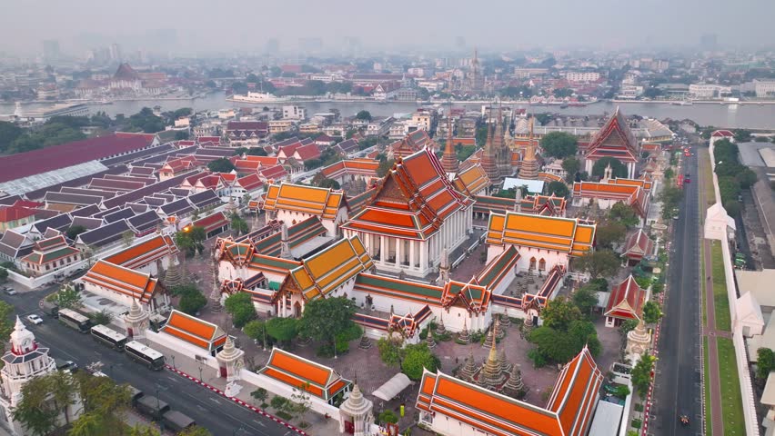 Wat Pho, Reclining Buddha temple aerial view, Bangkok panorama, Thai culture, drone view of capital of Thailand. High quality 4k footage Royalty-Free Stock Footage #1100137549