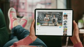 Point of View Woman Watching TV Cooking Show Montage on Tablet Computer via Video Sharing Service Social Media. Restaurant Kitchen with Female Chefs Talk, Prepare Healthy Meal. Online Video Course - Powered by Shutterstock - Get 15% off with code: PIKWIZARD15