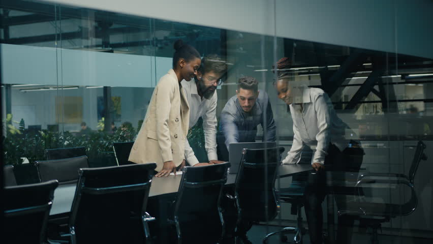 Multi-ethnic diverse business team coworkers colleagues corporate partners workers win with laptop celebrating good online result success stack hands put palms together united teamwork partnership | Shutterstock HD Video #1100145187