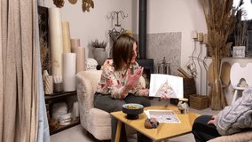 Middle-aged woman in casual clothing making prediction by analyzing human design chart indoors. Female astrologer forecasting fate of male customer fortune telling using bodygraph at esoteric room - Powered by Shutterstock - Get 15% off with code: PIKWIZARD15