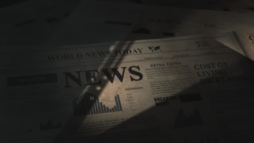 Breaking News headline in dramatic unveiling of article in old vintage daily newspaper in the archive