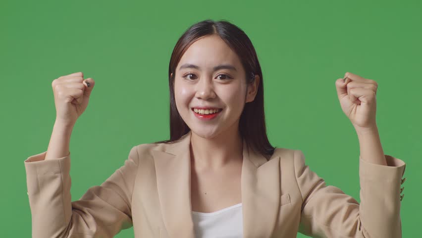 Close Up Of Asian Business Woman Smile And Flex Muscle On Green Screen Background In The Studio
 | Shutterstock HD Video #1100149197