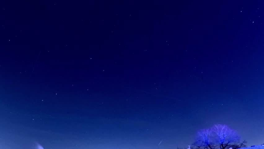 Star trails with dark blue sky