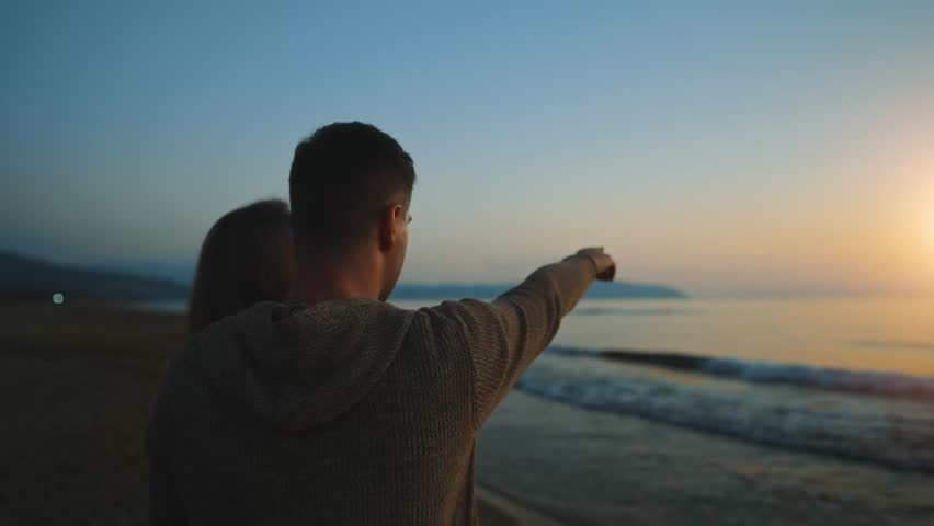 Attractive couple enjoy the sunset and chat about life. | Shutterstock HD Video #1100160831