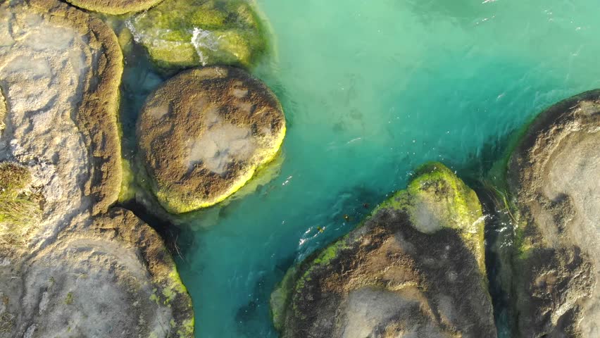 Aerial Drone Shot of Ancient Stromatolites in seven colores lagoon near Bacalar, Quintana Roo, Mexico