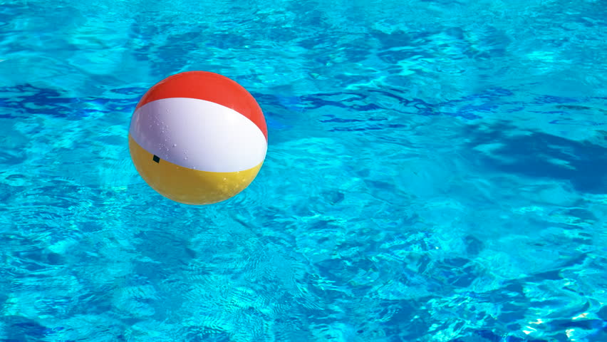 Floating inflatable ball in clear pool. A view of colorful floating inflatable ball in the clear pool water under sun. | Shutterstock HD Video #1100163879