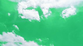 The green screen of moving white clouds with 4K resolution. Can use to change the background color.