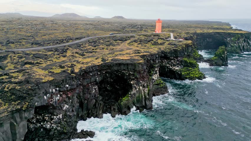 Drone footage of stormy sea and Svortuloft Lighthouse on a cold autumn day