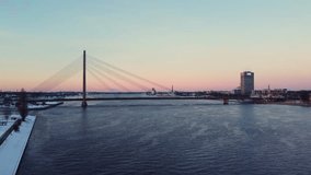 Vanšu Bridge over river Daugava in Riga, Latvia, drone view in winter