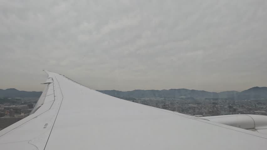 A landing airplane in Japan.