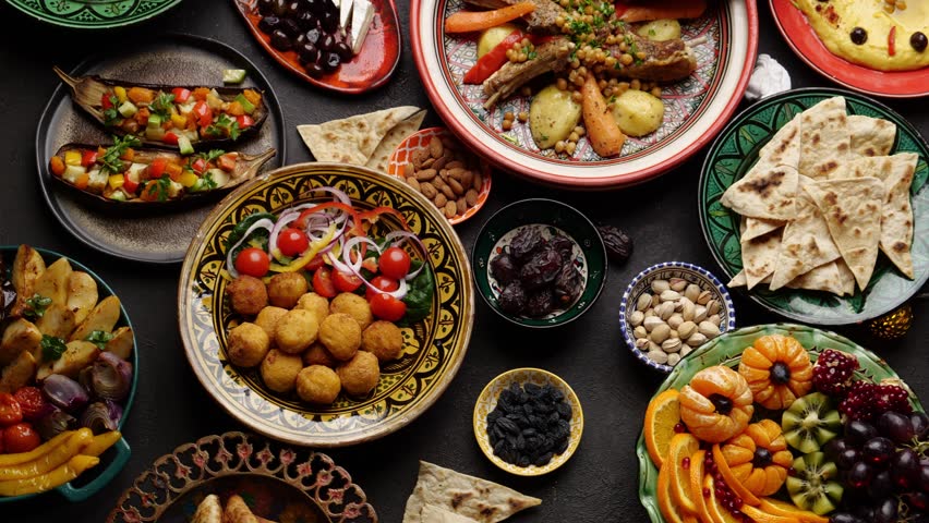 Fasting during Ramadan, Iftar time, People at the table. Authentic Middle Eastern local homemade meals in traditional dishes Royalty-Free Stock Footage #1100170647