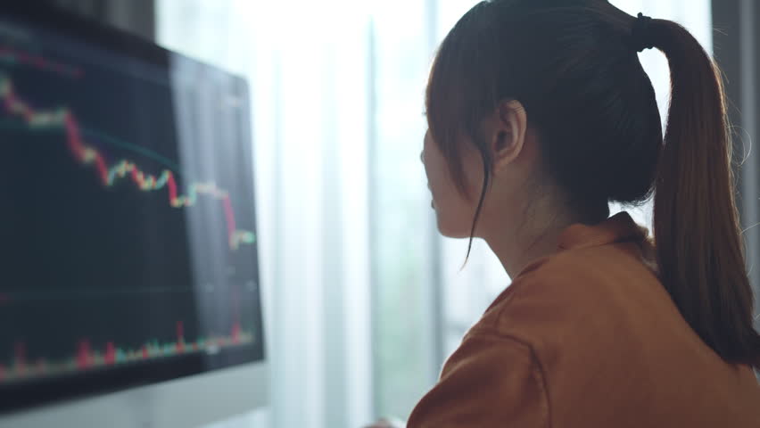 Sad Upset woman after seeing stock prices fall in the trading on computer screen at home, Depressed investor, stock market loss analysis, collapse. Royalty-Free Stock Footage #1100171253