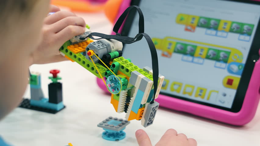 Children Play With Lego And Create Programmable Robots. Close-up Of Robotics. Royalty-Free Stock Footage #1100178177