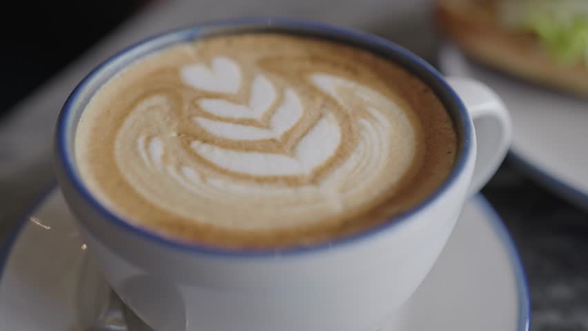 Close Up Cup of Coffee on The Table | Shutterstock HD Video #1100179539