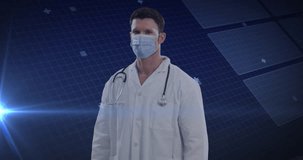 Animation of caucasian male doctor in mask and scientific data processing over blue background. Global medicine, digital interface, computing and data processing concept digitally generated video.