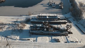 The lagoon in winter scenery. Frozen lake. snowy winter on the lake. Industrial scenery. Drone Footage
