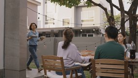 Mom enjoy cooking for family day dining at dine table cozy patio front yard home. Mum passing food serving drink to group four asia people young adult man woman friend fun joy relax warm picnic eating - Powered by Shutterstock - Get 15% off with code: PIKWIZARD15