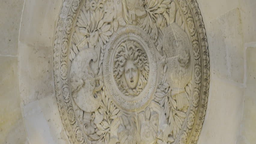 Sculptural ceiling. Action. Old architecture in the ceiling of a large spacious building.