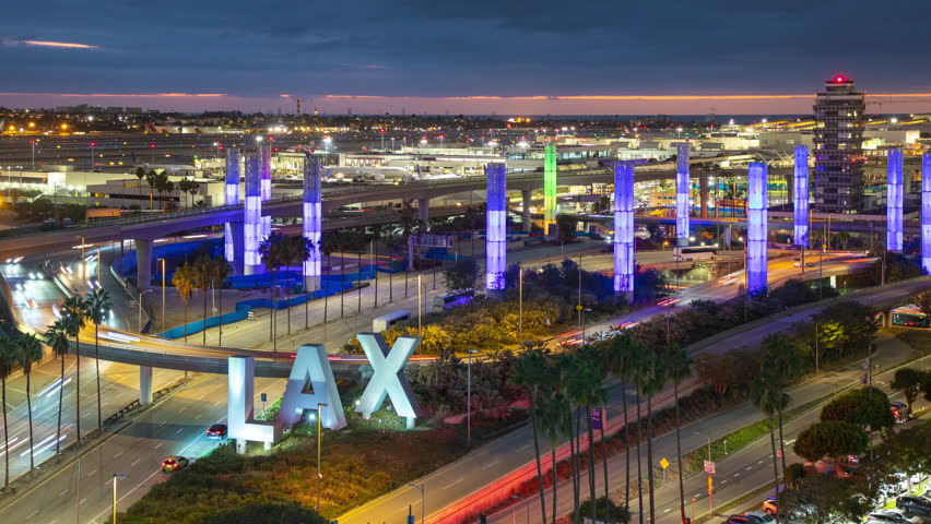 LOS ANGELES, CA - 2023: Generic LAX International Airport Airfield Landscape Sunset Timelapse with Arriving and Departing Vehicle and Airliner Traffic in California