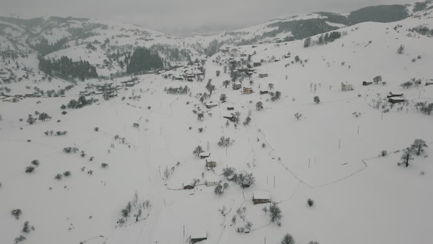 Winter Landscape with Small Village Houses Between Snow Covered Forest in Cold Mountains. Giresun - Turkey