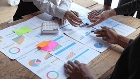 Financial analyst analysis business financial report on digital tablet during discussion at meeting of corporate showing the results of their successful teamwork., business meeting concept, Marketing - Powered by Shutterstock - Get 15% off with code: PIKWIZARD15