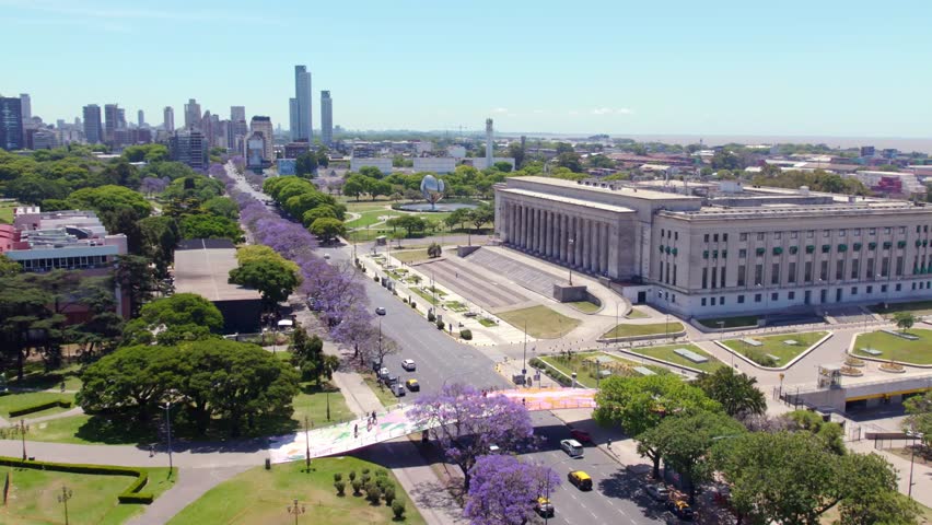 Traffic On The Thoroughfare In Buenos Aires, Argentina Passing By The University Of Buenos Aires Faculty Of Law.