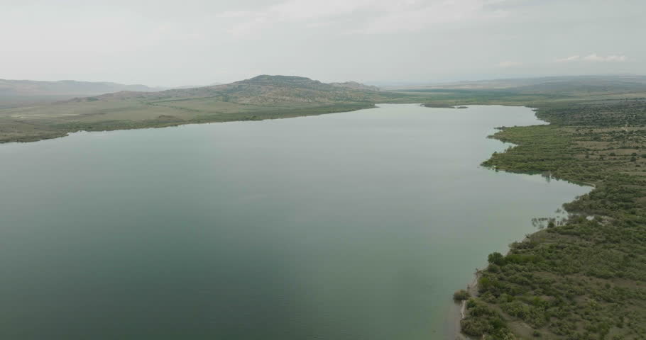 Vast Dalis Mta water reservoir with steppe landscape around, Georgia.
