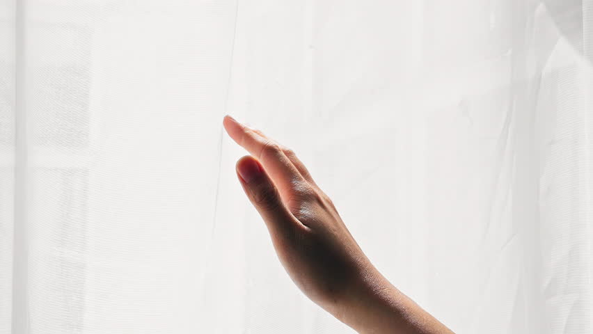 Close up asian woman dragging her hand on clean white curtain gently at home - relaxing soft comfortable concept Royalty-Free Stock Footage #1100206345