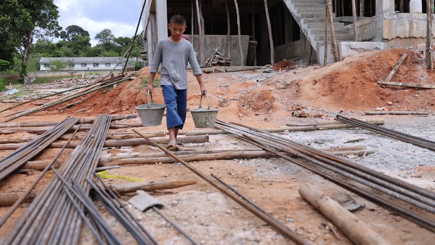 Children are forced to work in construction. anti child labor Abuse, oppression or coercion, forced child labor Human trafficking. 4K slow motion. | Shutterstock HD Video #1100208965