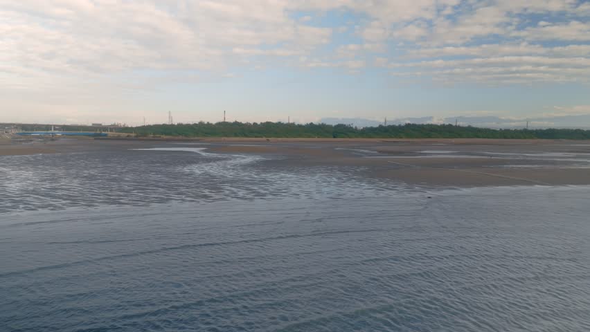 Youg-an fish harbor's beach and Taoyuan Xinwu city view