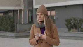 Side view portrait of an asthmatic woman using a inhaler outdoors in the street - Powered by Shutterstock - Get 15% off with code: PIKWIZARD15